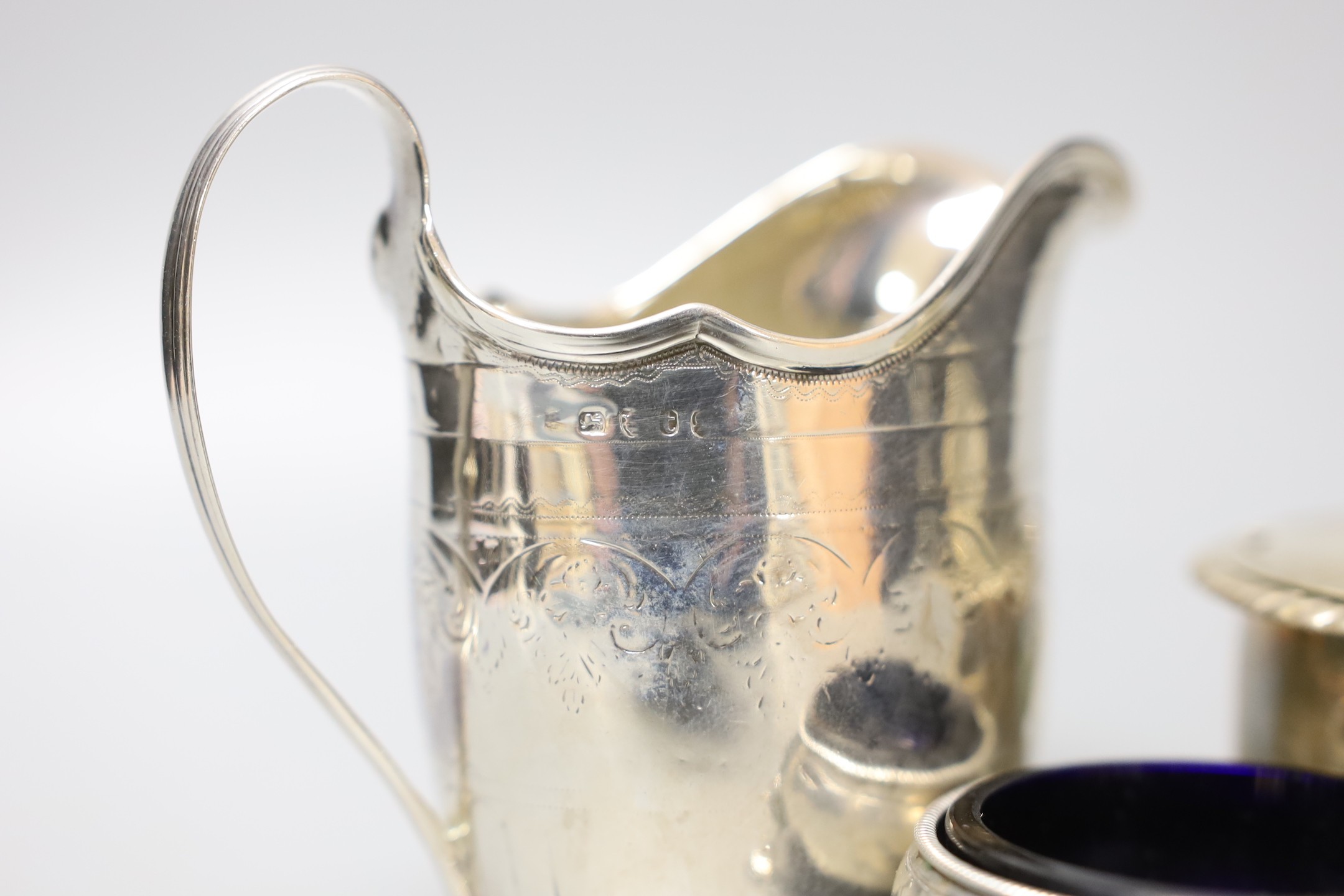 A George III silver cream jug, London, 1794, 10.3cm, a Georgian silver mustard pot and a Georgian silver salt.